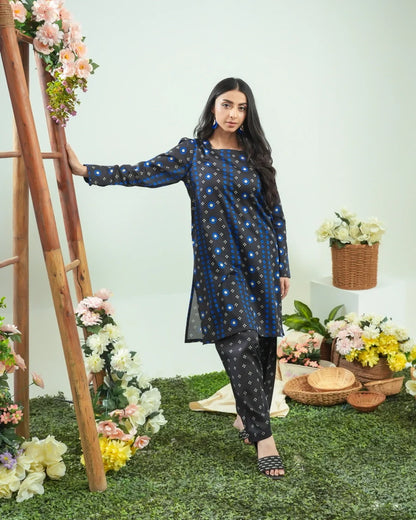 Women’s navy blue geometric print kurta with black patterned pants, long kurta