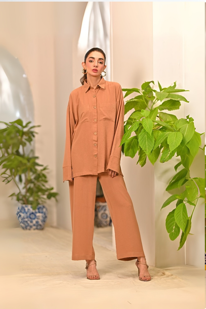 Women's tan button-up long-sleeve shirt with straight-leg pants set