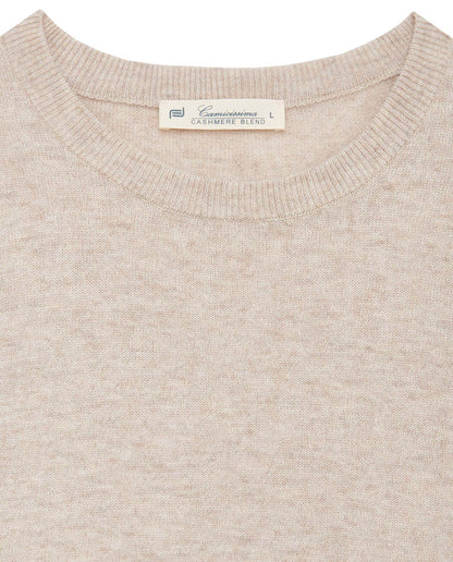 Cream knit sweater crew neck close-up with interior neck label
