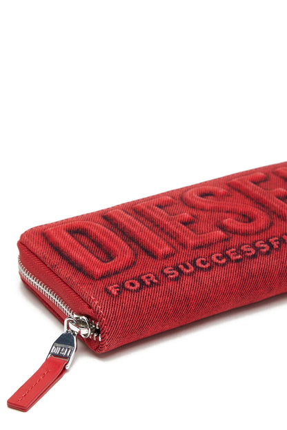 Red zip wallet close-up with embossed lettering and wrist strap