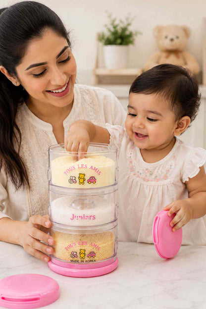 Pink clear kids snack container with pink lid and stacked compartments