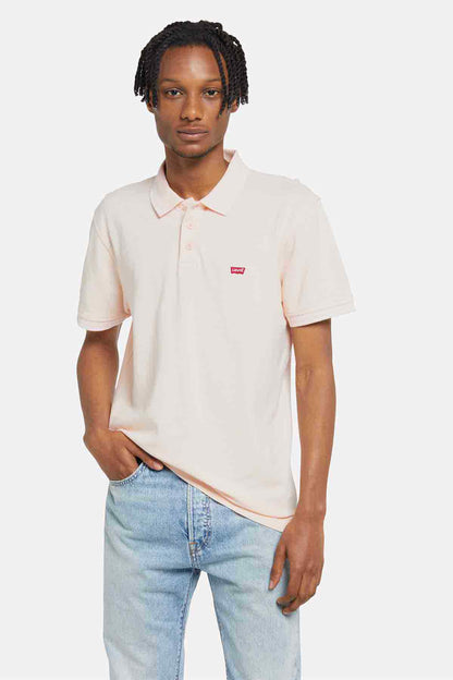 Levi's light pink polo shirt with short sleeves, button placket, and chest logo