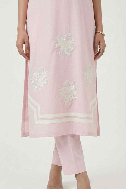Light pink kurta hem with floral embroidery and white border, paired with matching pants