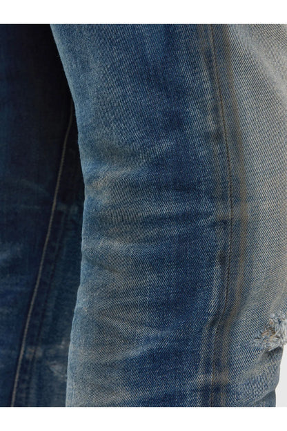 Faded denim jeans with stitched seams and textured whiskering detail