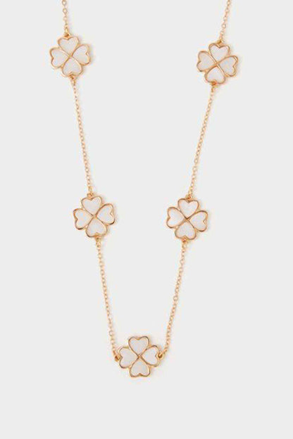 Gold-tone long necklace with four flower clover charms on chain