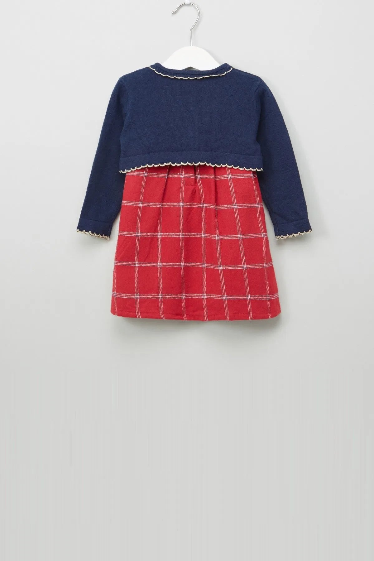 Baby dress with dark blue yoke and red plaid skirt, long sleeves, scalloped hem