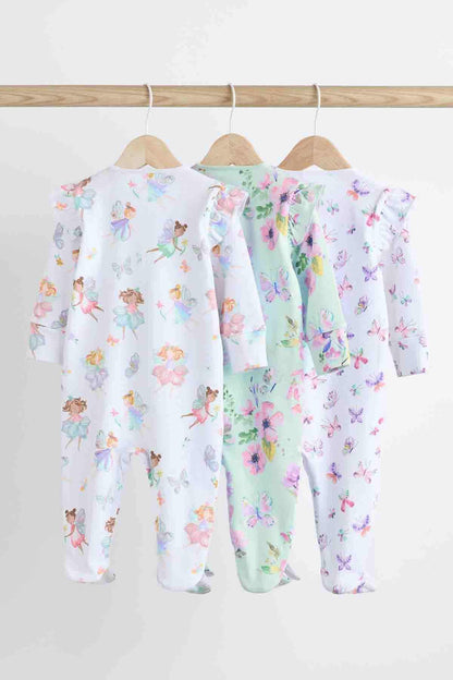 Three white pastel floral baby onesies with front zip, footed pajama pants