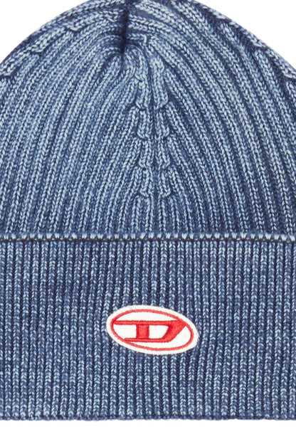 Blue knit beanie with cable pattern and oval Diesel logo patch on front