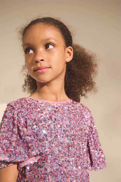Girls' pink sparkly dress with round neckline and flutter sleeves, close-up
