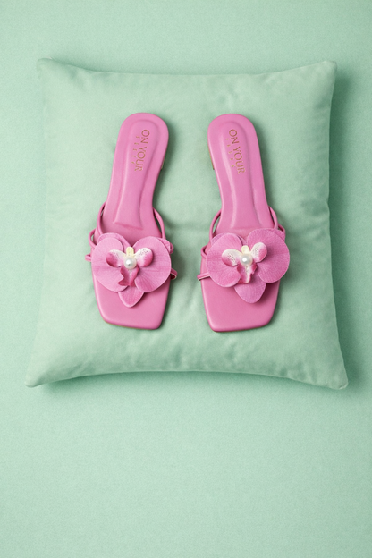 Dark pink flat slide sandals with pink flower applique and pearl bead detail