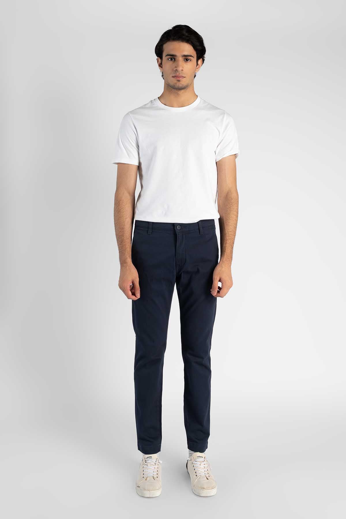 Blue jeans front view with belt loops, button closure, and cuffed hem