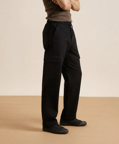 Fitted black cargo pants with cargo pocket panels and relaxed straight leg