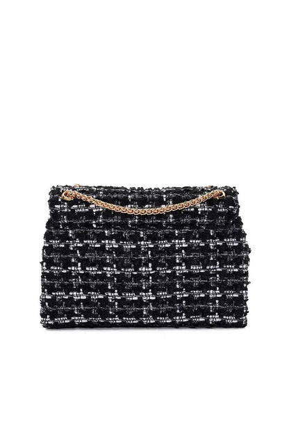 Black tweed-style clutch bag with white fleck pattern and gold chain handle