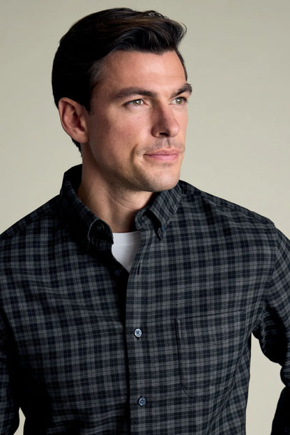 Grey check button-up shirt with collared neckline and dark buttons
