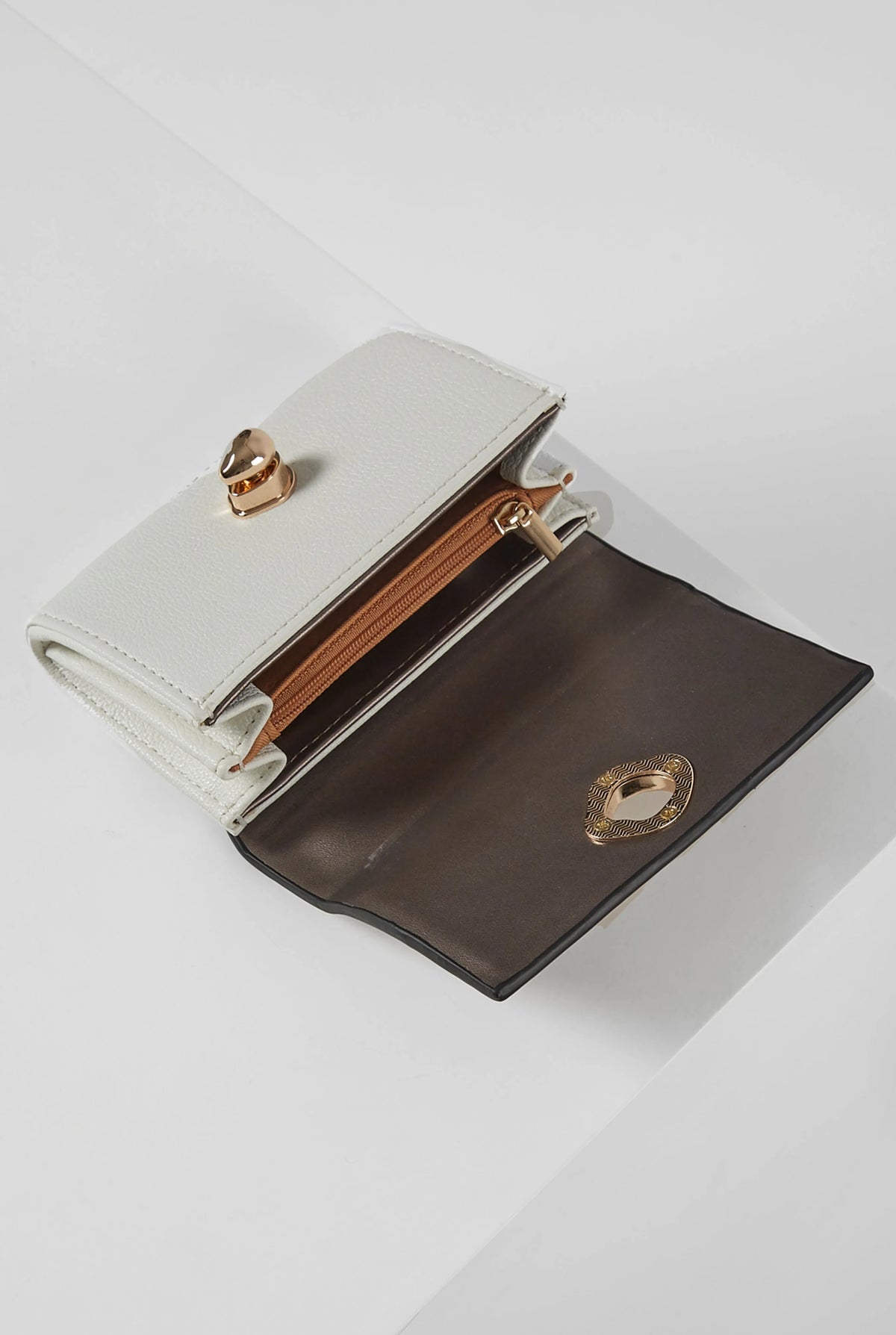 Two-tone brown and white leather wallet with gold snap clasp, open front