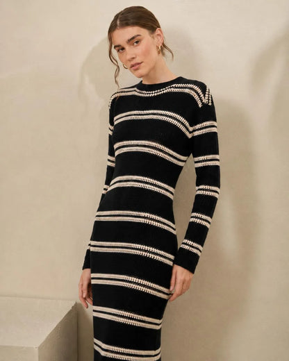 Black and cream striped knit maxi dress with long sleeves and crew neck