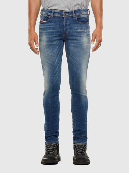 Blue slim-fit denim jeans with straight legs and belt loops
