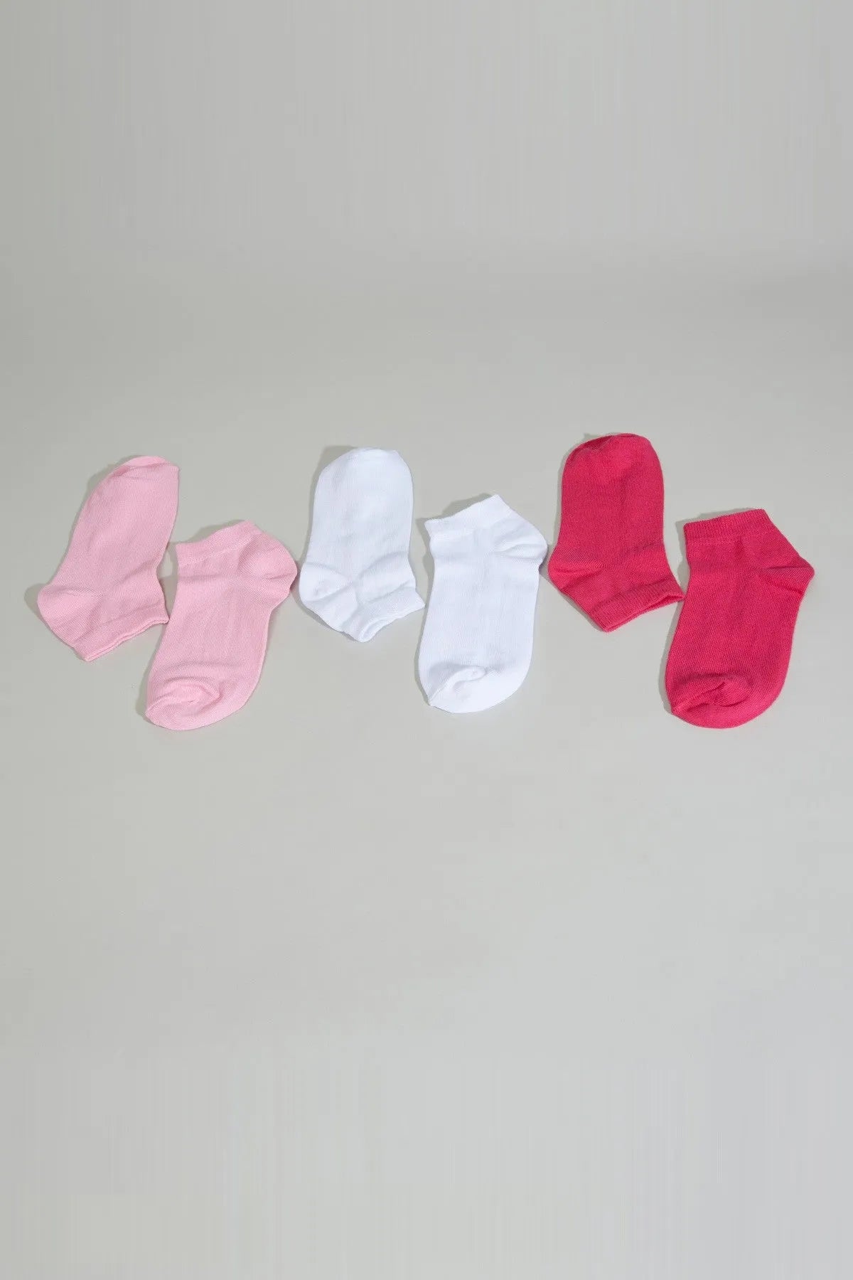Baby socks set: pink, white, and red ankle socks