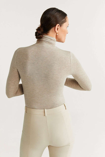 Sand knit turtleneck top and tailored trousers, high collar, back view