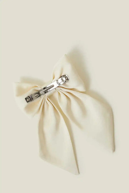 Cream bow hair accessory with metal clip