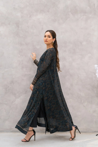 Velour maxi dress from side view, dark teal ornate print, long sleeves, maxi length
