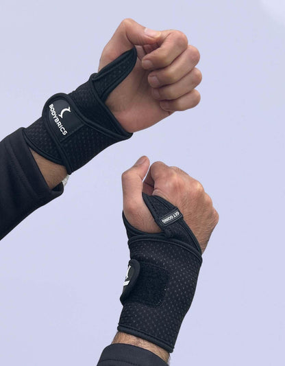 Bodybrics black wrist wrap brace, padded support panel and thumb loop
