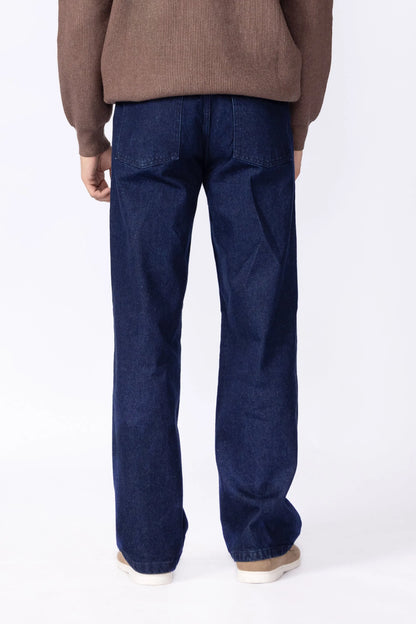 Blue denim jeans with straight leg and cuffed hem, close-up of front