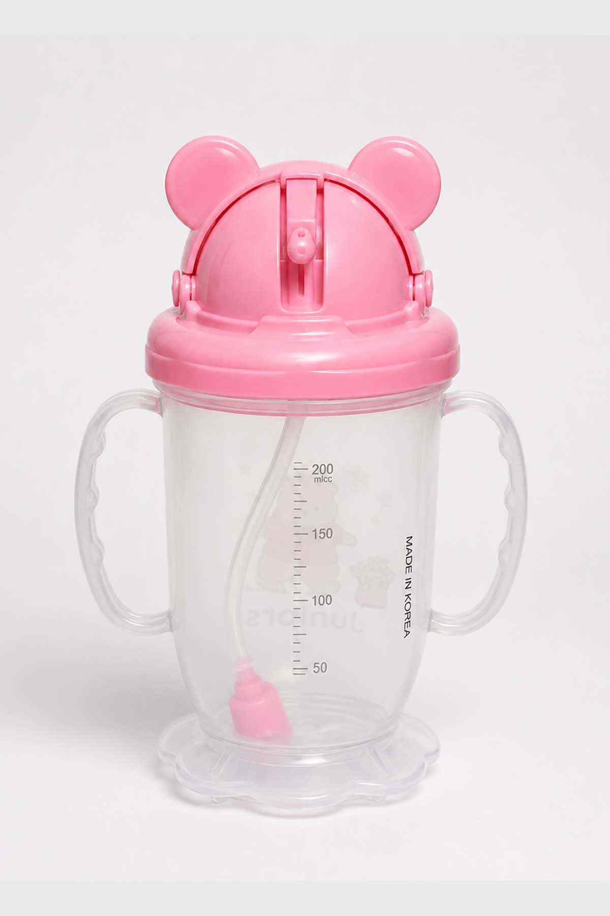 Pink bear-eared toddler sippy cup with handles, flip spout and measurement marks