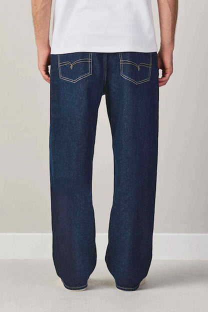 Dark blue straight-leg jeans with contrast topstitching and patch pockets