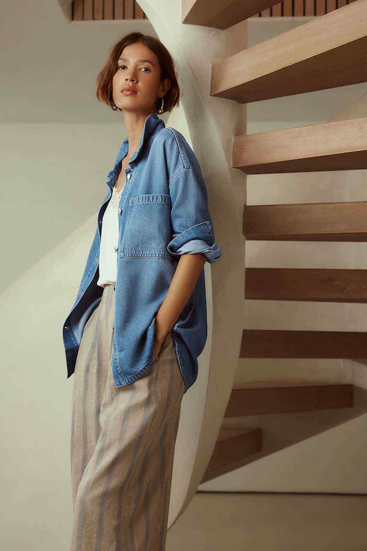 Next mid blue denim jacket with button front and chest pockets in side view