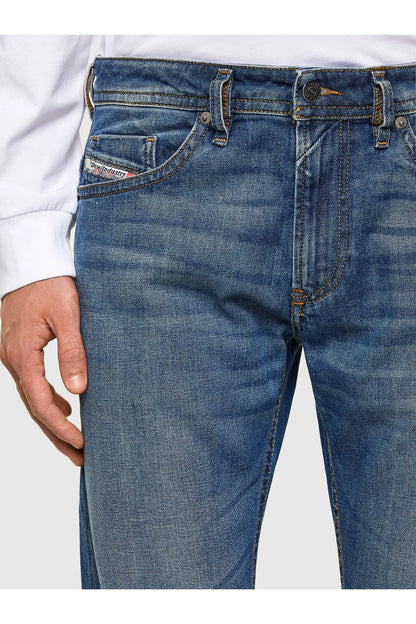 Blue jeans with front pockets, belt loops, and dark topstitching