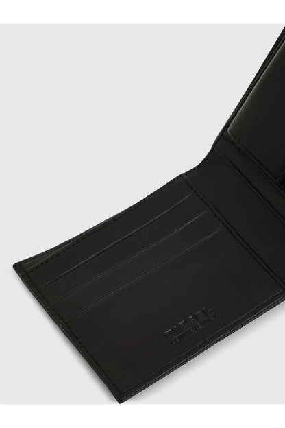Black leather bifold wallet card holder section with embossed Diesel logo