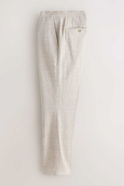 Light beige suit trousers flat lay with zip fly and front pleats