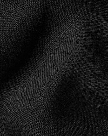 Black shirt fabric close-up with fine woven texture