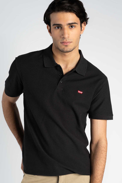 Black polo shirt with short sleeves and small chest logo