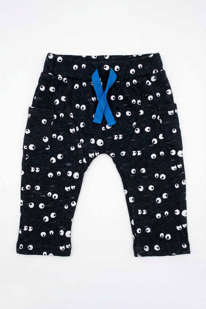 Navy baby pants with white eye print and blue bow at elastic waist