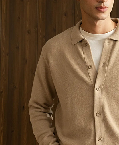 Beige fitted knit cardigan with collared neckline and buttoned front