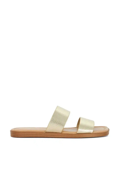 Gold metallic two-strap slide sandals with flat open toe and low wood sole