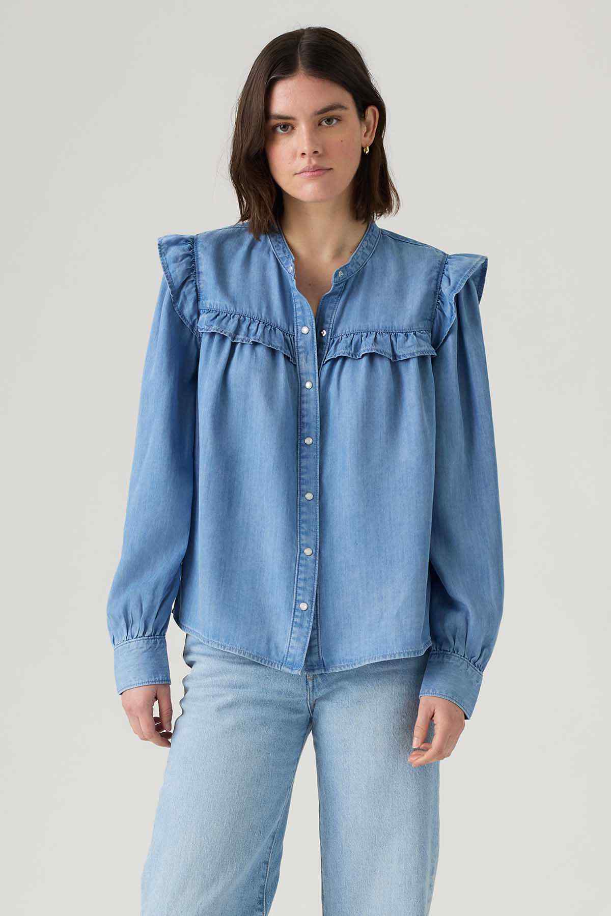 Levi's light blue denim blouse with high ruffle collar and button placket
