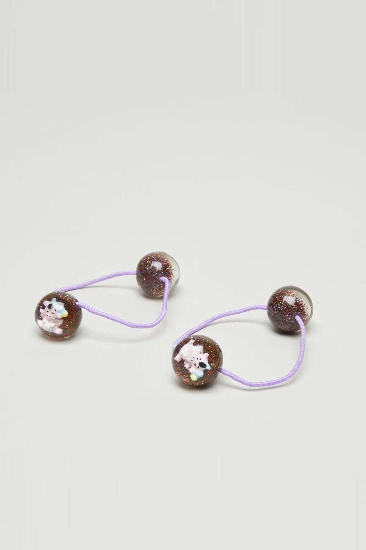 Set of two kids hair elastics with purple bands and glittery brown bead charms