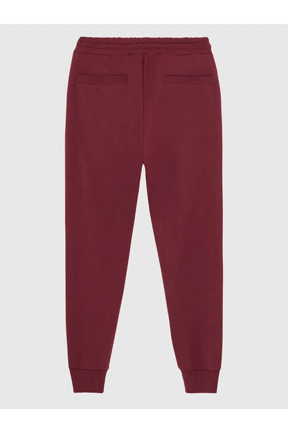Maroon Diesel jogger pants with pocket details and ribbed cuffs