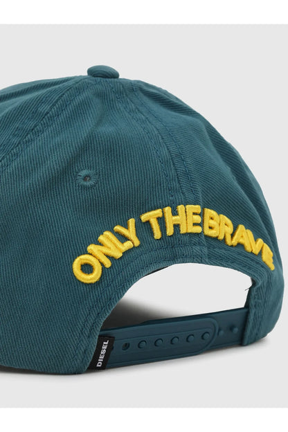 Sea green baseball cap with yellow "ONLY THEBRAN" text on back, curved brim