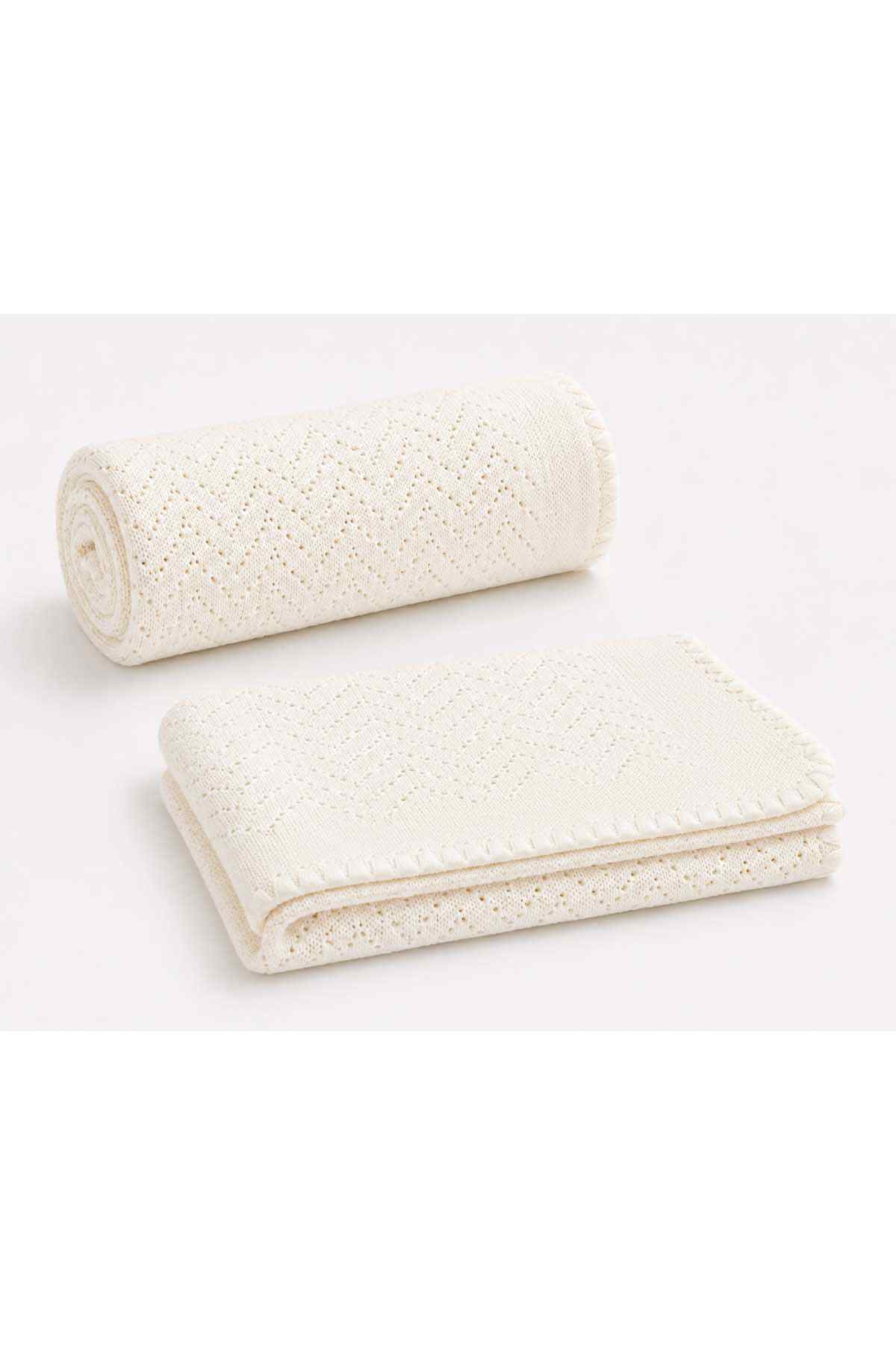 White knitted baby shawl roll and folded piece, openwork texture
