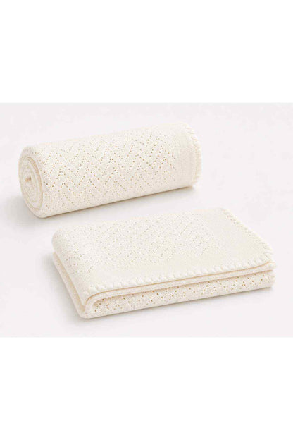 White knitted baby shawl roll and folded piece, openwork texture
