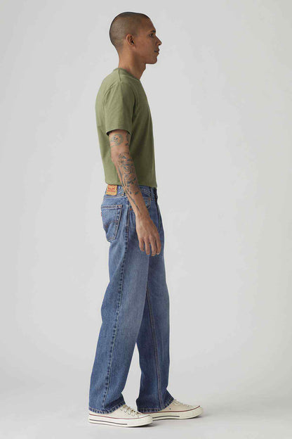 Dark wash jeans shown in side view, straight-leg cut