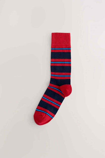 Red crew sock with navy and light-blue horizontal striped bands