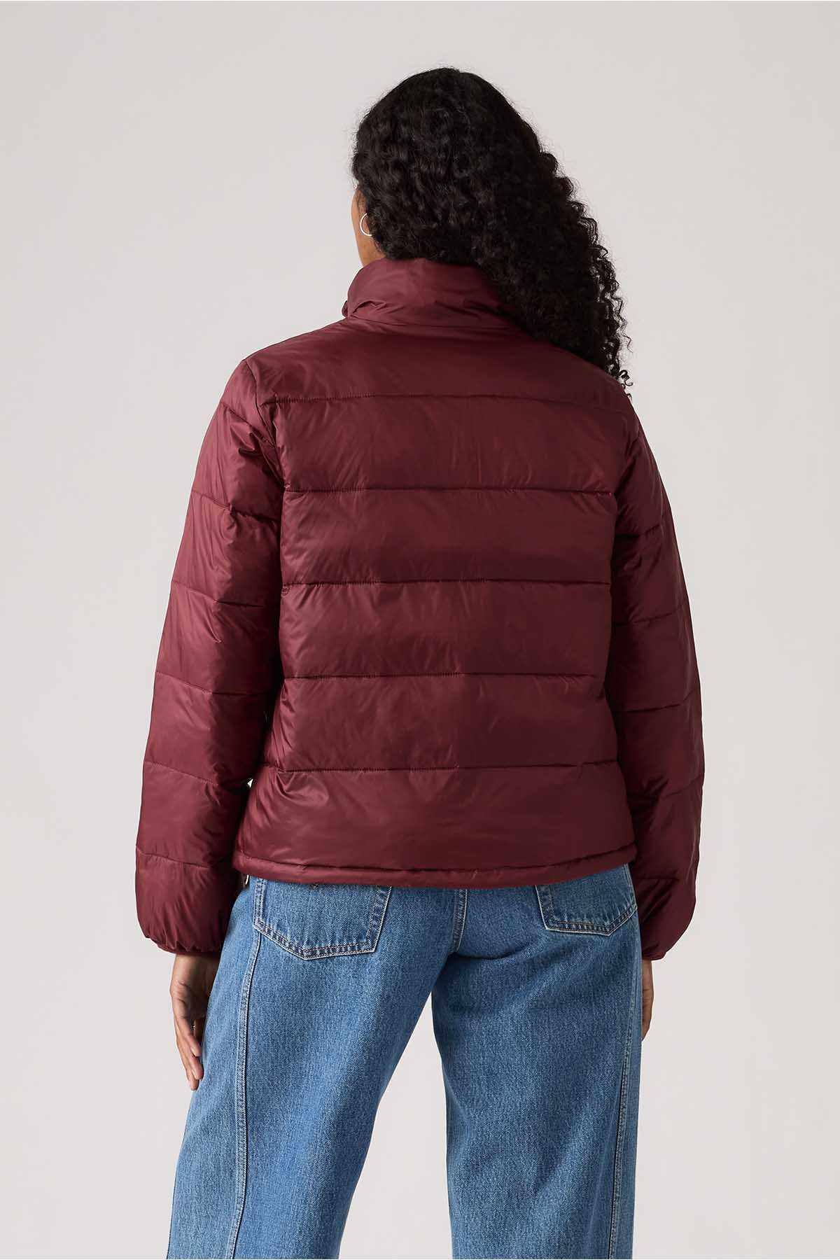 Burgundy puffer jacket back view with quilted panels and full-zip closure