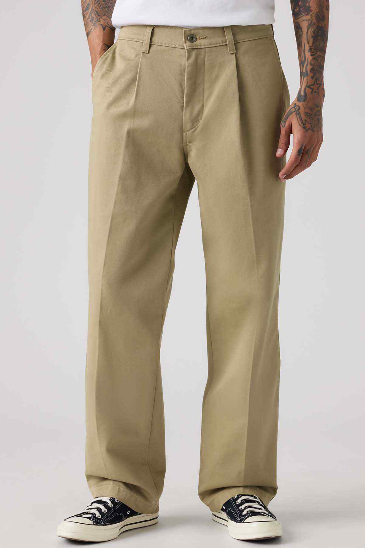 Levi's tan chino pants, front view with crease lines and buttoned fly