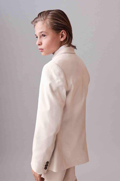 Cream suit blazer shown from the back in side view