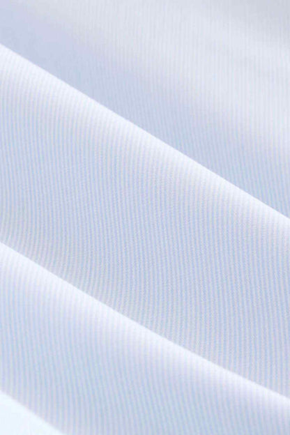 Light blue shirt fabric close-up with fine striped texture